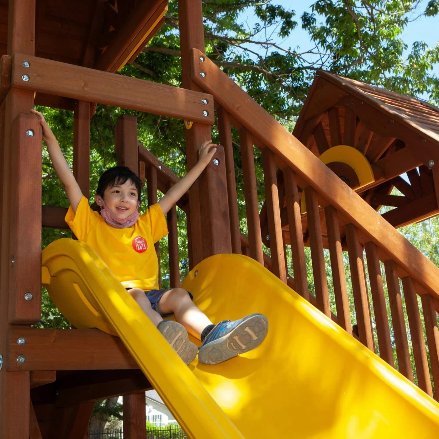 A NorCal Arts camper on a playground during an outdoor activity
