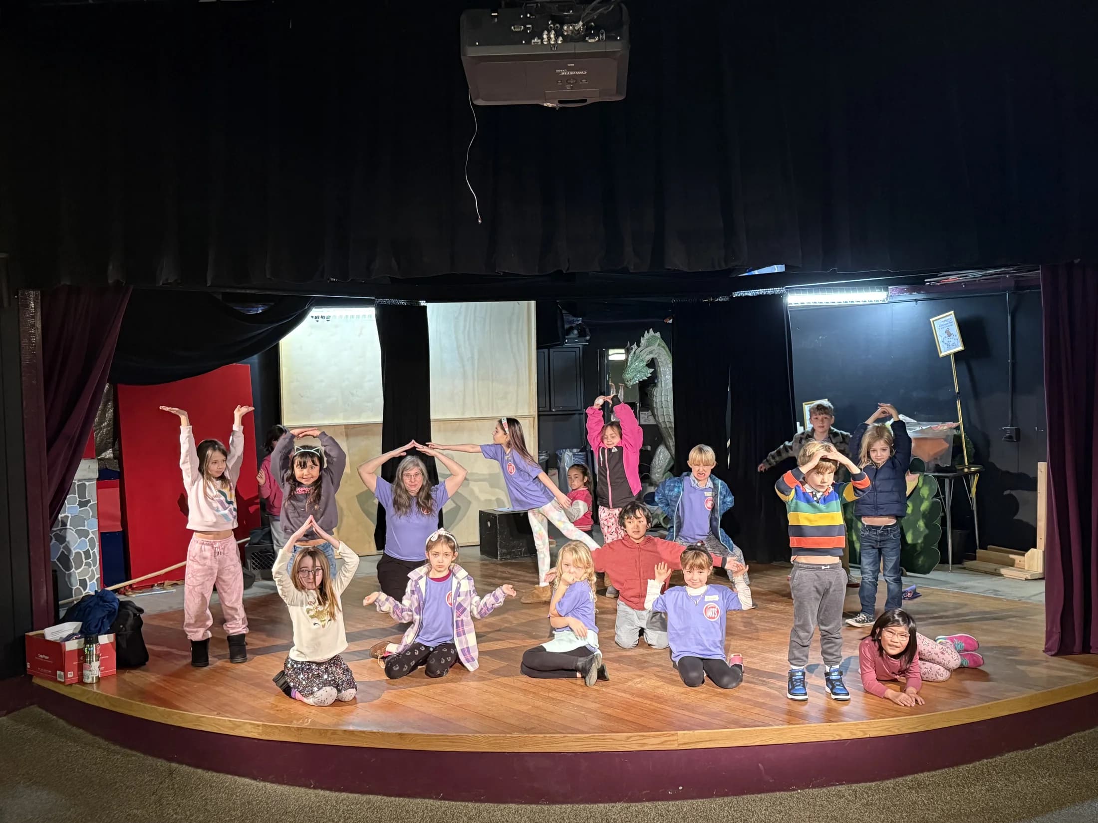 Young NorCal Arts performers practicing together on a stage