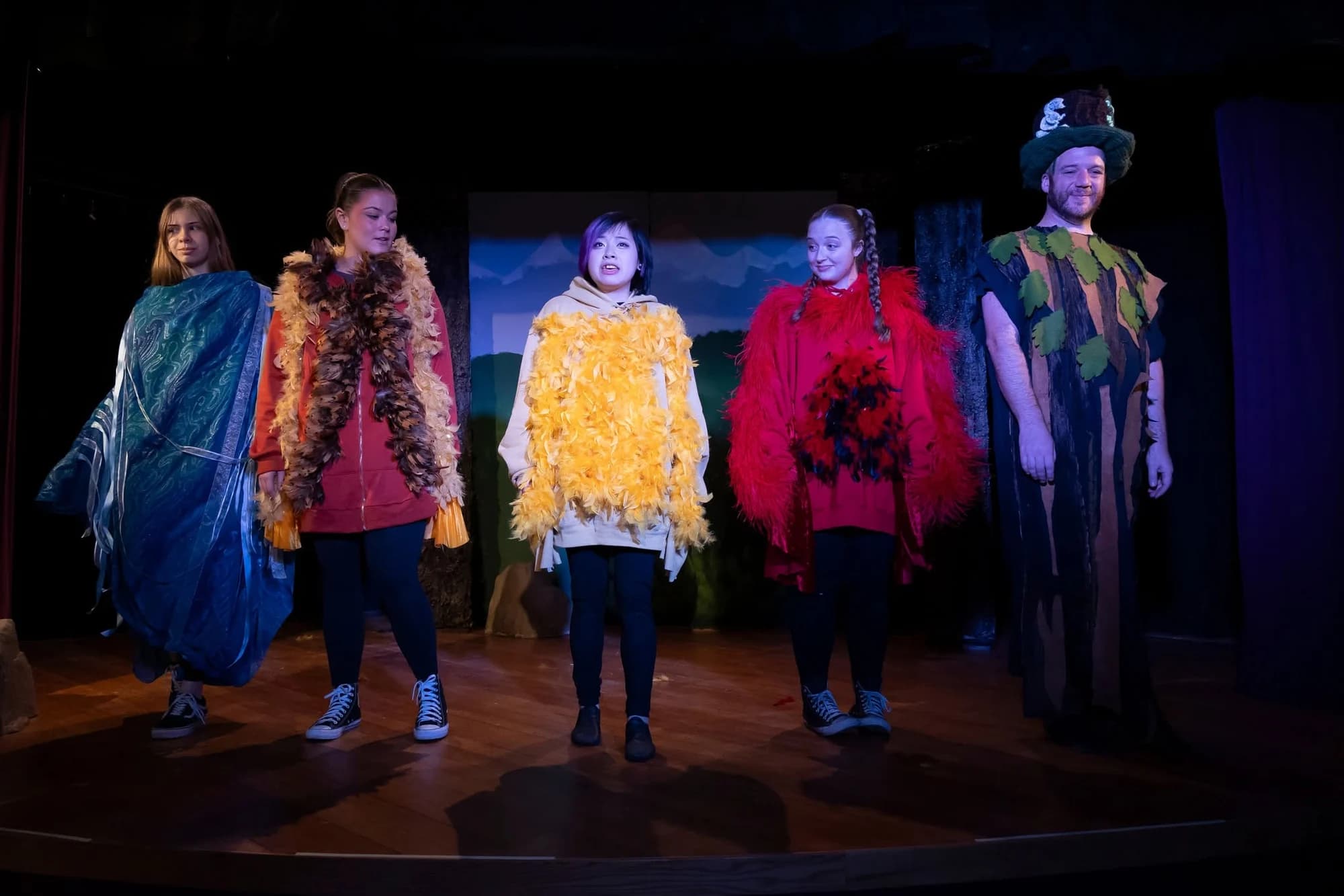 NorCal Arts performers in colorful costumes in Little Bird’s Second Chance
