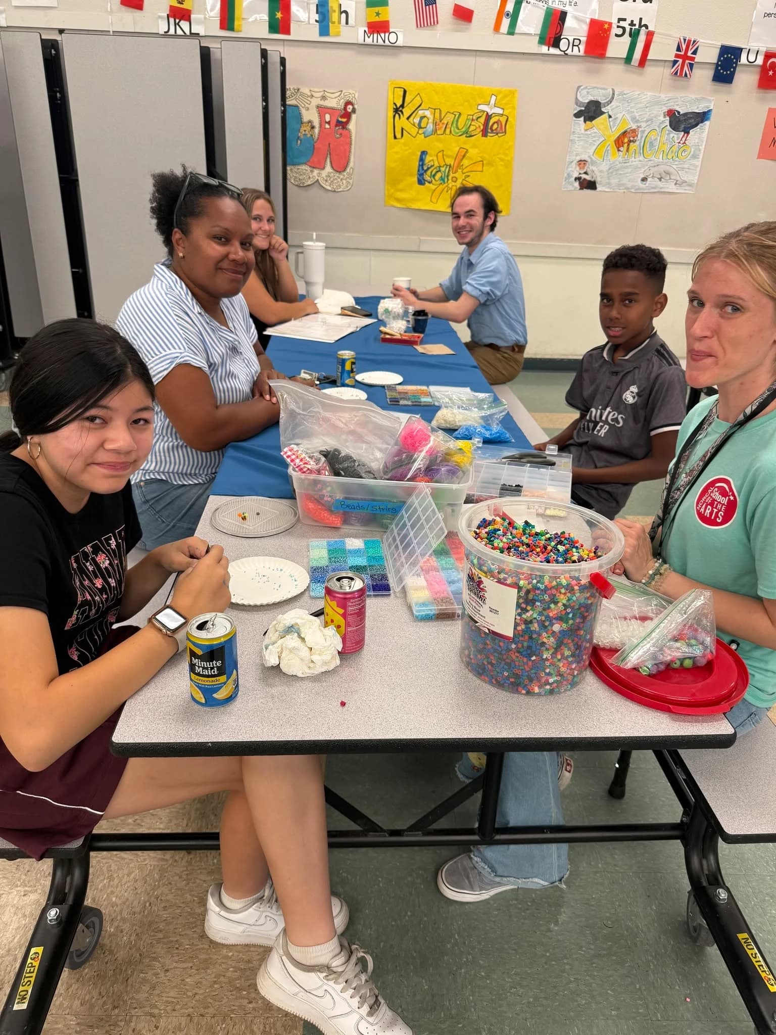 A NorCal Arts volunteer supporting young students